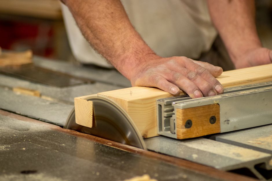 Professional carpenter installing a custom cabinet system